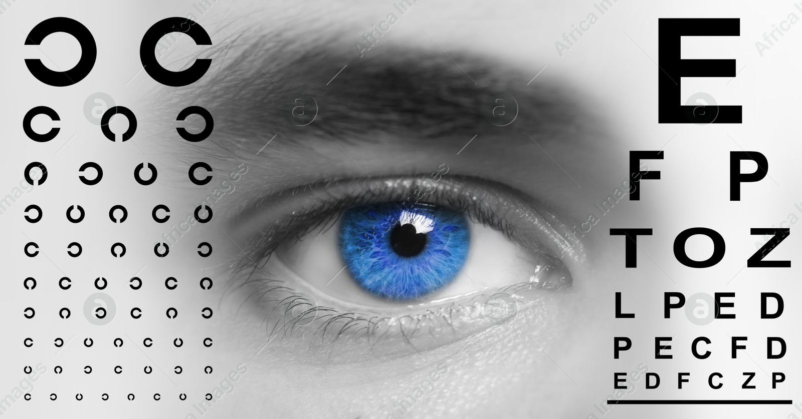 Image of Eye charts and closeup of man's eye. Vision acuity test. Color toned