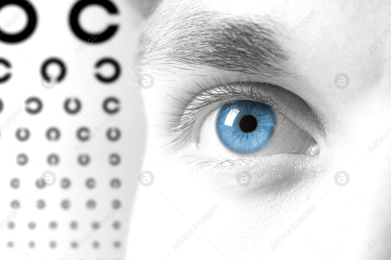 Image of Landolt ring chart and closeup of man's eye on white background. Color toned