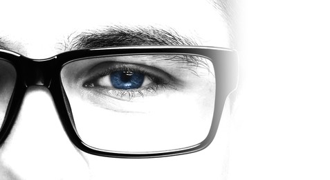 Image of Closeup view of man wearing eyeglasses on white background, banner design. Color toned