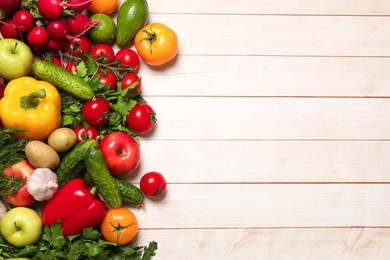 Photo of Different vegetarian products on light wooden table, top view. Space for text