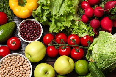 Different vegetarian products on wooden table, top view