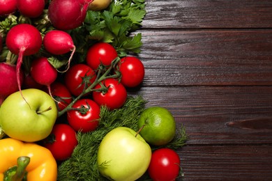 Different vegetarian products on wooden table, top view. Space for text