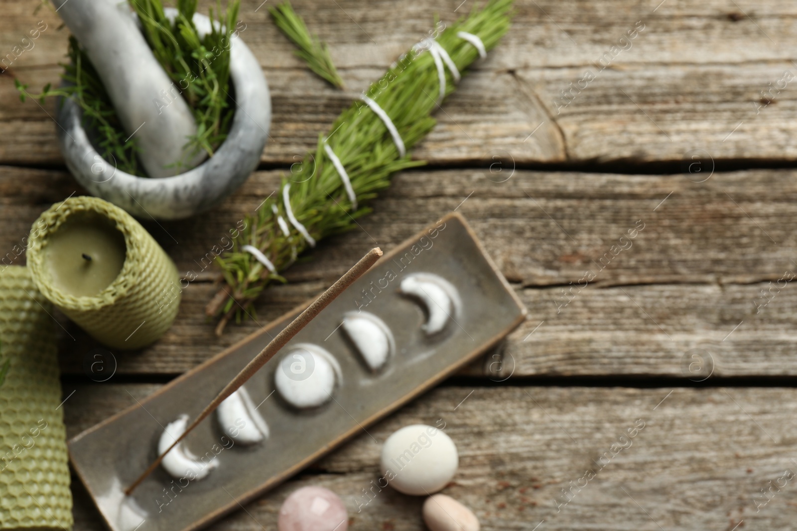 Photo of Flat lay composition with incense stick in holder on wooden table, space for text