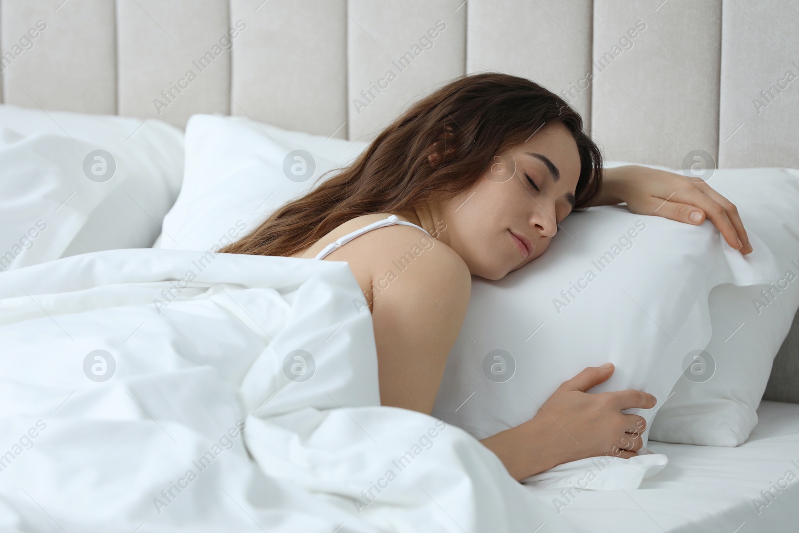 Photo of Bedtime. Beautiful woman sleeping in bed at home