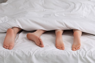 Photo of Lovely couple lying in bed, closeup view