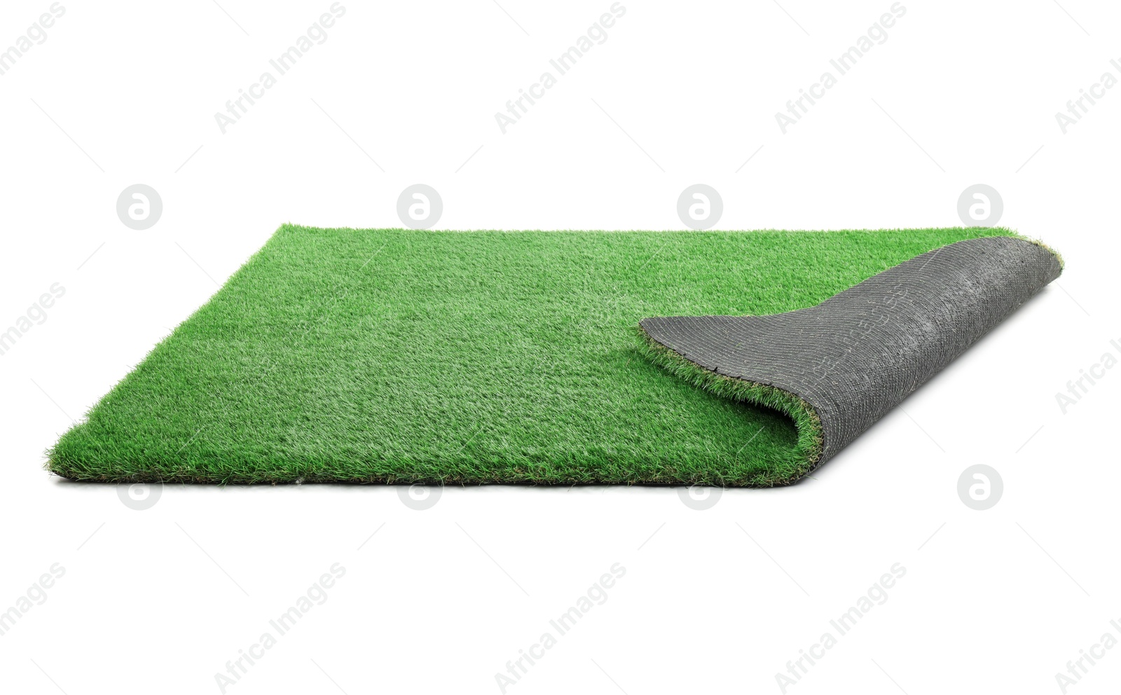 Photo of Green artificial grass isolated on white. Garden decor