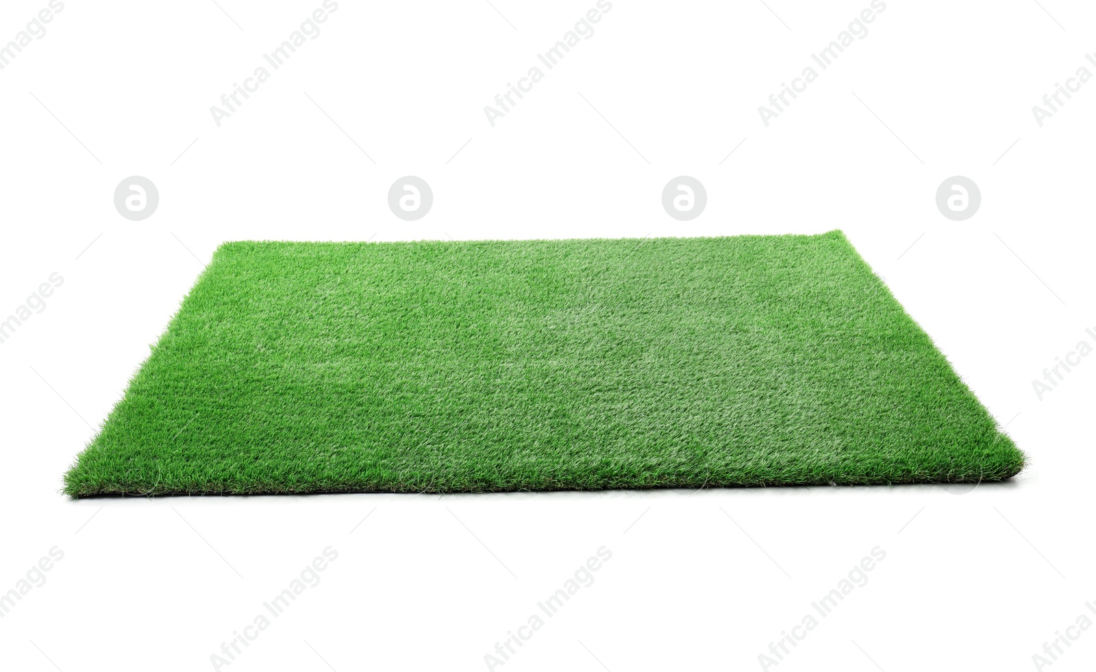 Photo of Green artificial grass isolated on white. Garden decor