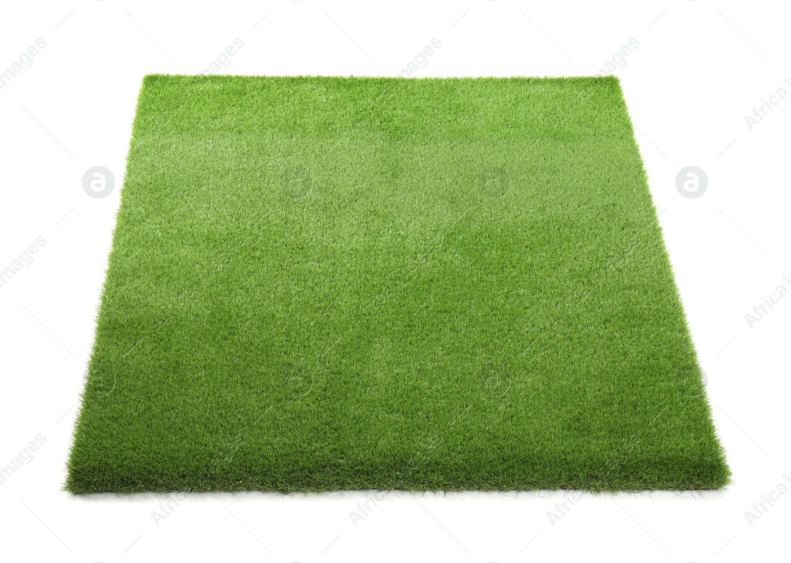 Photo of Green artificial grass isolated on white. Garden decor