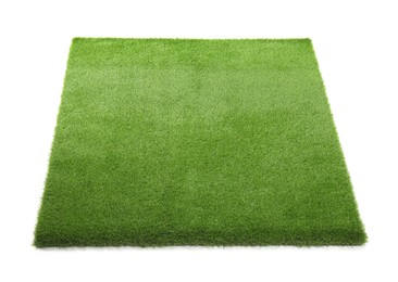 Photo of Green artificial grass isolated on white. Garden decor