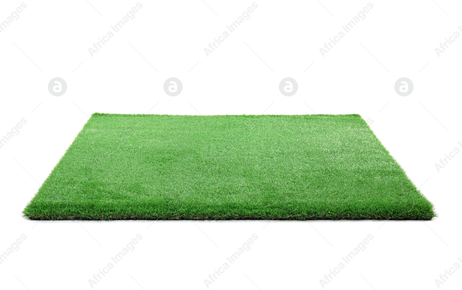 Photo of Green artificial grass isolated on white. Garden decor