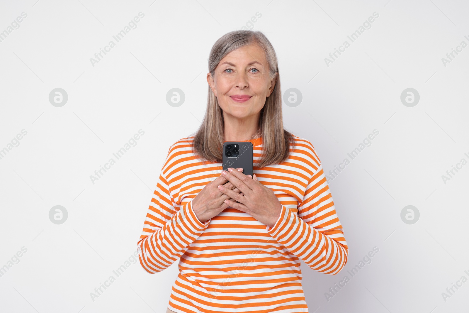 Photo of Senior woman with phone on light grey background