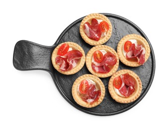 Photo of Delicious canapes with jamon, cream cheese and cherry tomatoes isolated on white, top view