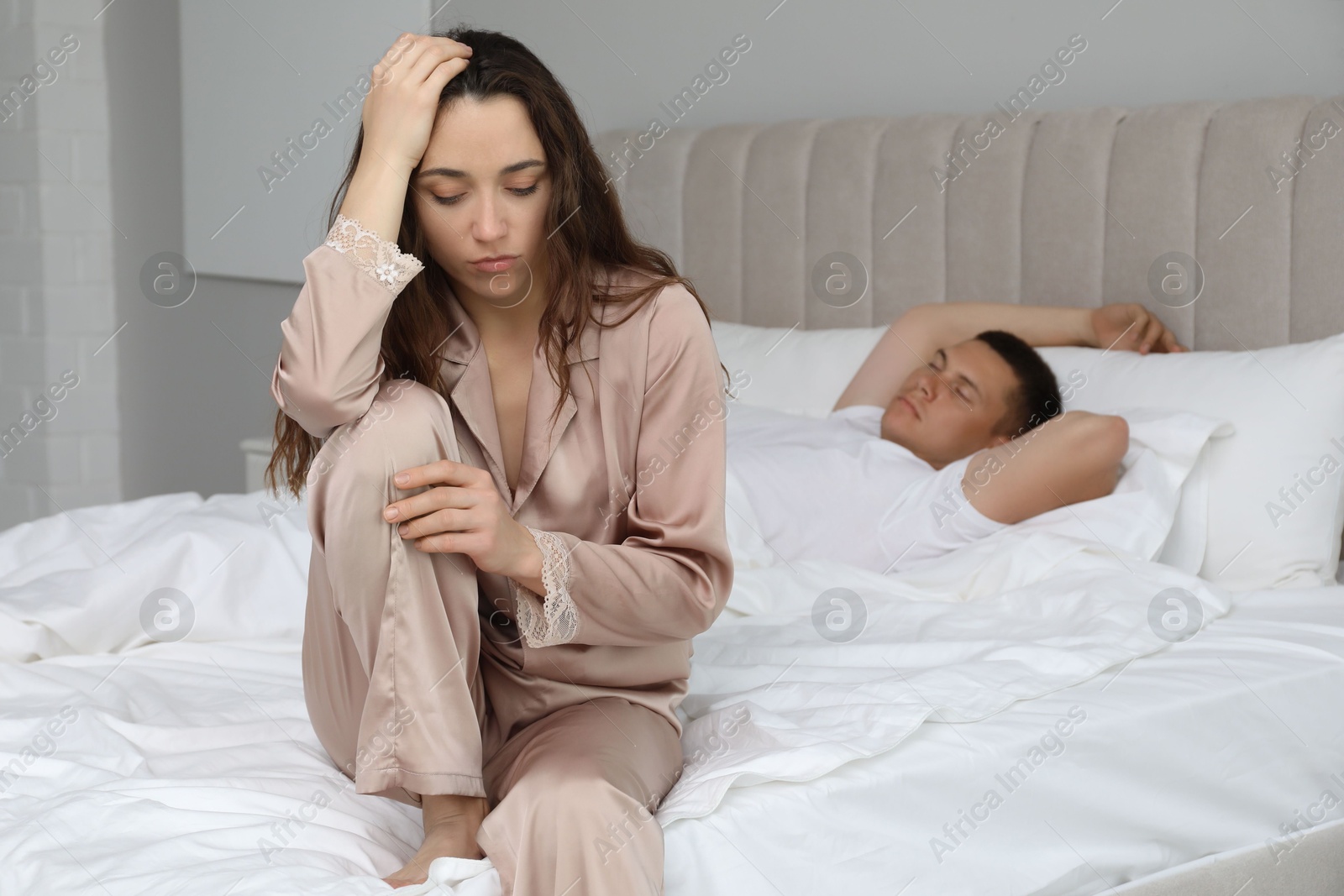 Photo of Offended couple after quarrel in bedroom. Relationship problem