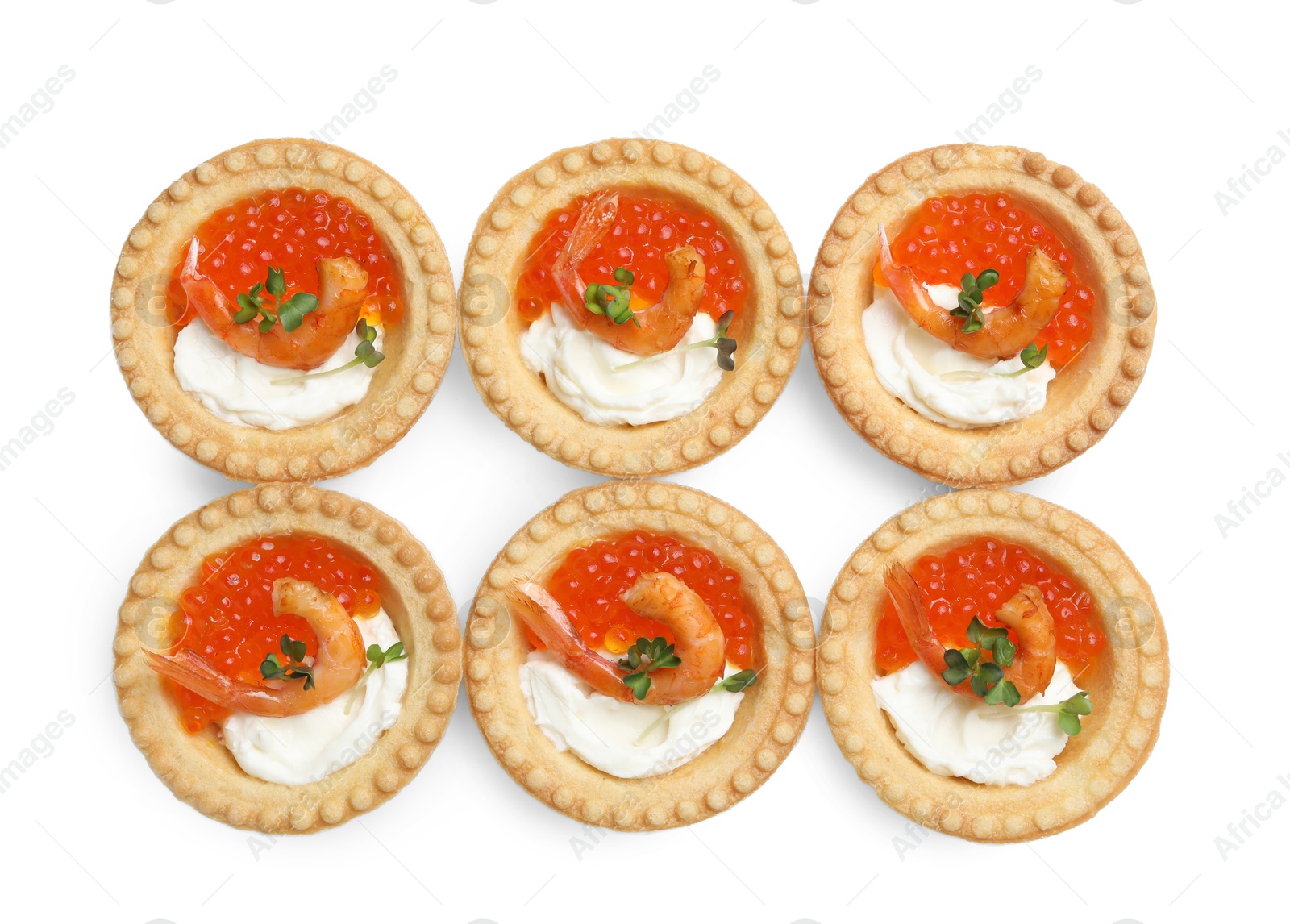 Photo of Delicious canapes with shrimps, red caviar and cream cheese isolated on white, top view