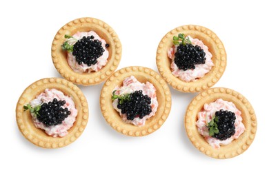 Photo of Delicious canapes with black caviar isolated on white, top view