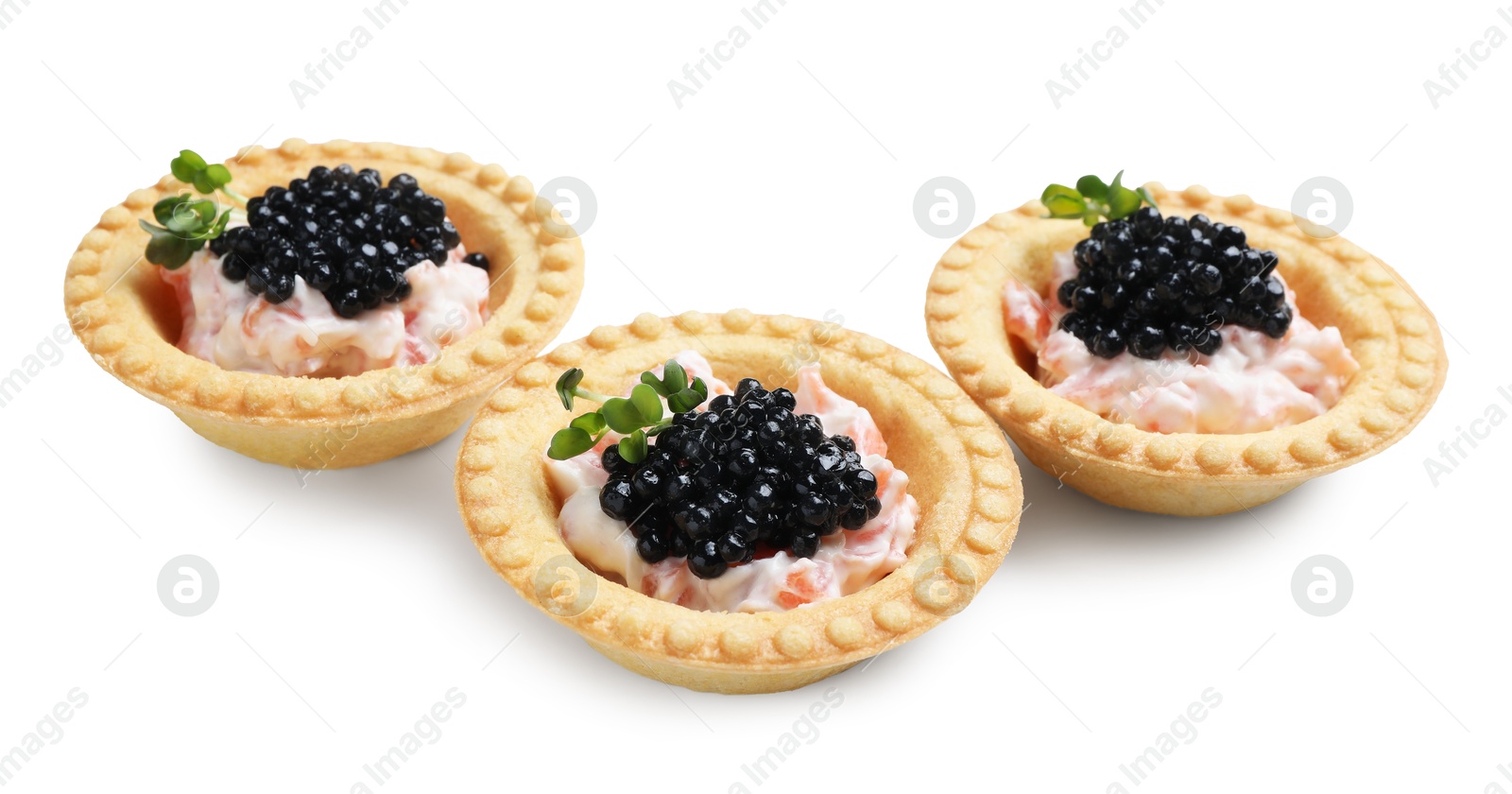 Photo of Delicious canapes with black caviar isolated on white