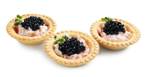 Photo of Delicious canapes with black caviar isolated on white