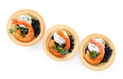 Delicious canapes with shrimps and black caviar isolated on white, top view