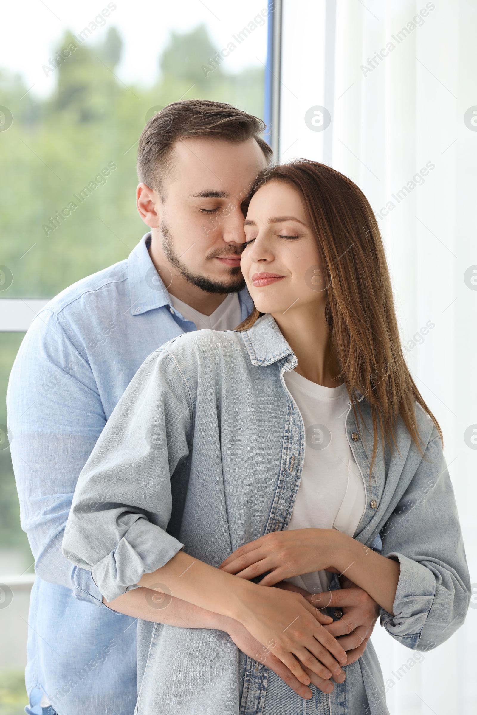 Photo of Cute couple hugging at home. Strong relationship