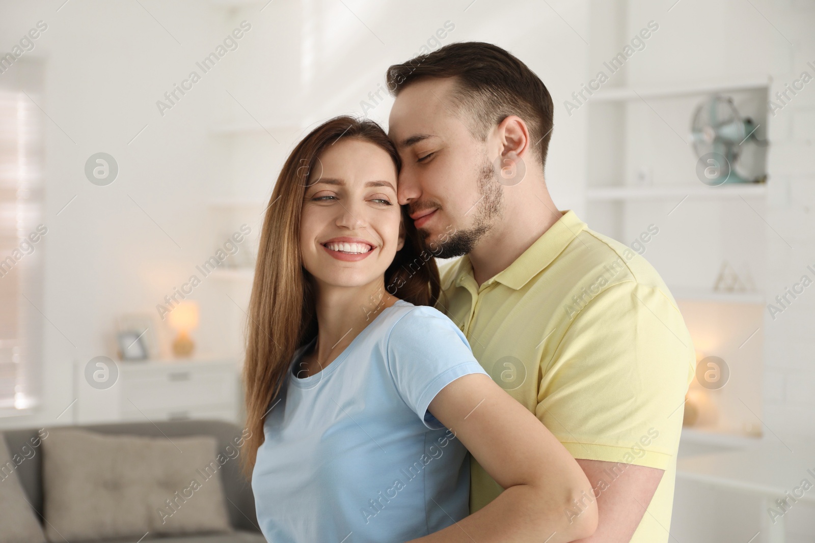 Photo of Happy couple enjoying each other at home