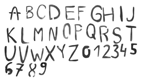 Photo of Alphabet written by grey spray paint isolated on white, top view