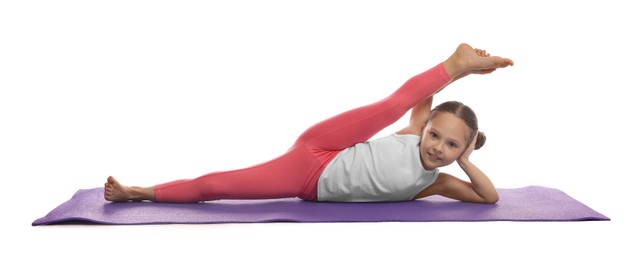 Photo of Cute little girl stretching on white background