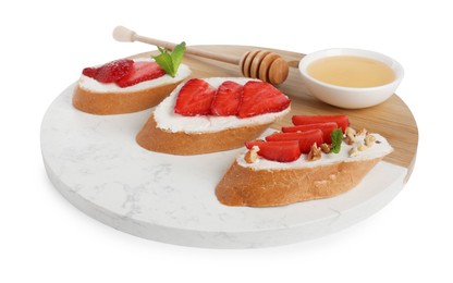 Photo of Delicious bruschetta with ricotta cheese, mint, walnuts, strawberries and honey isolated on white