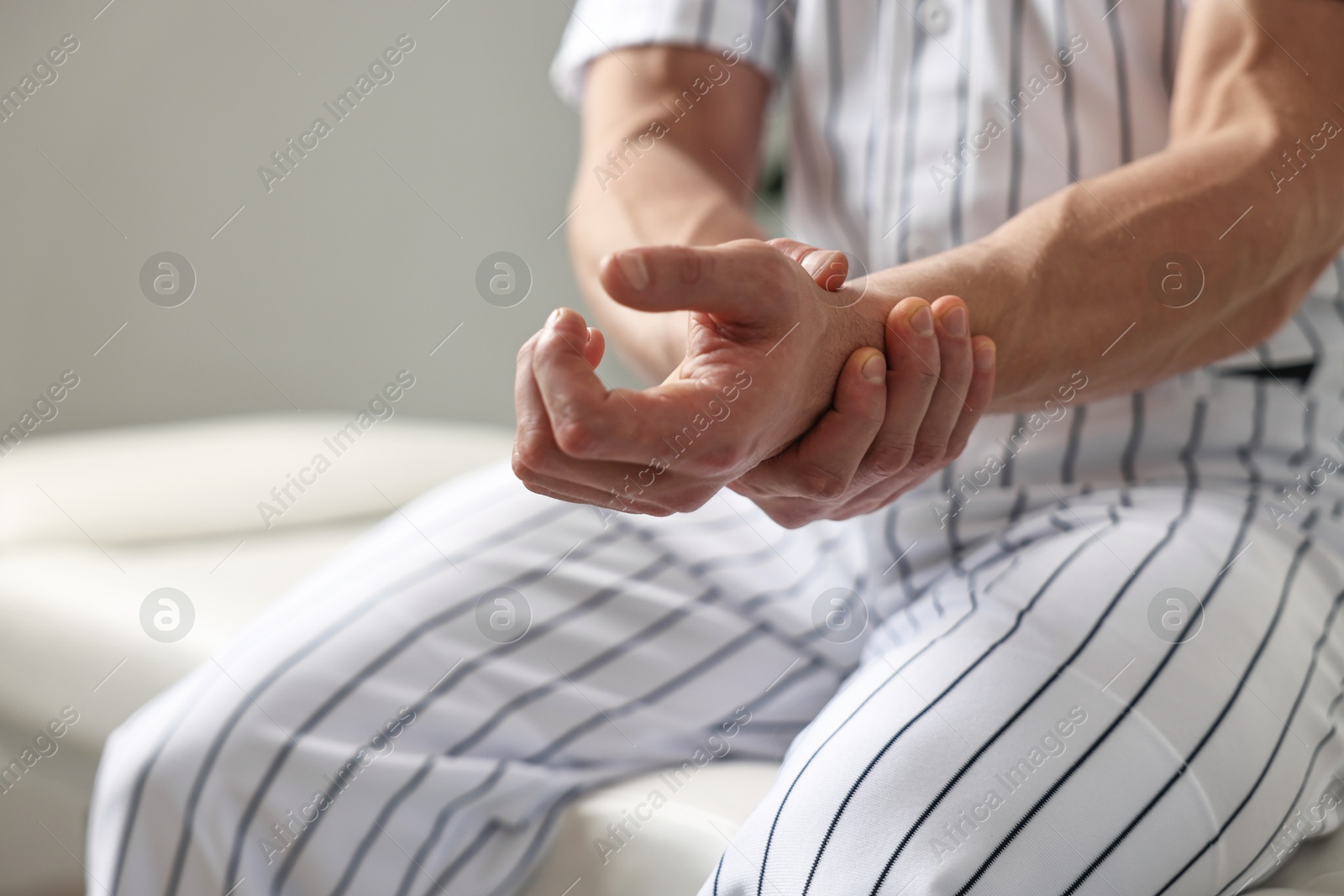 Photo of Sportsman with injured hand in hospital, closeup