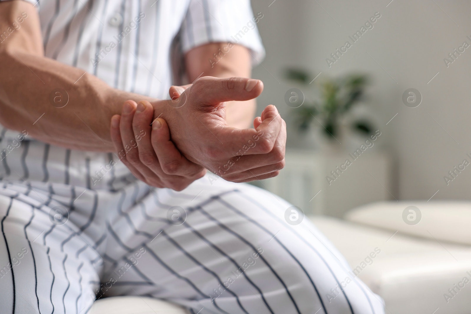 Photo of Sportsman with injured hand in hospital, closeup