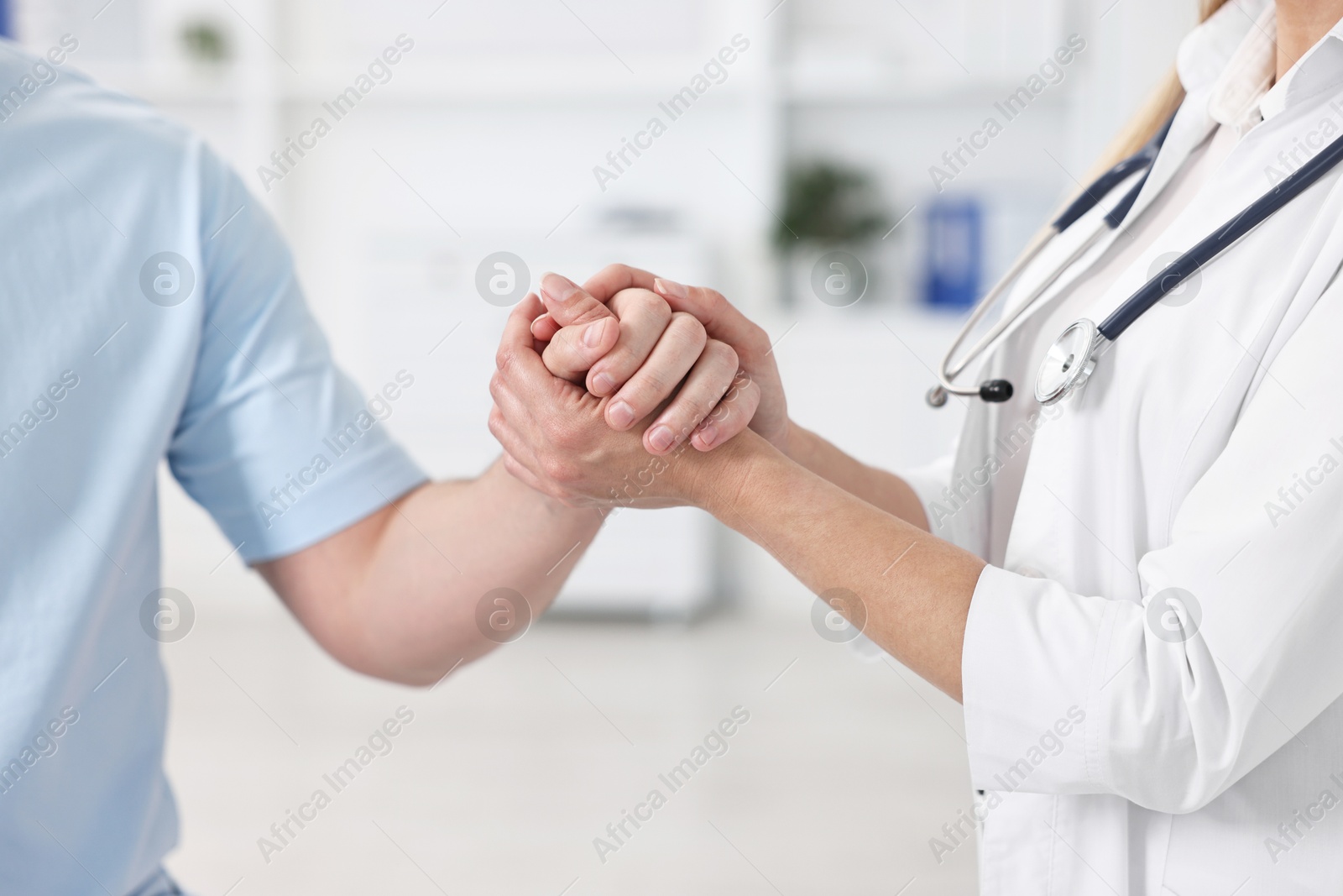 Photo of Professional doctor working with patient in hospital, closeup