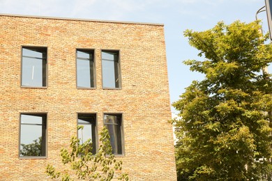Photo of Exterior of brick building with glass windows