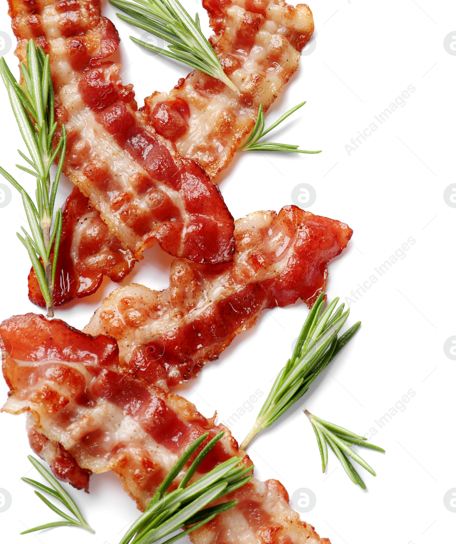 Photo of Slices of tasty fried bacon with rosemary on white background, flat lay. Space for text