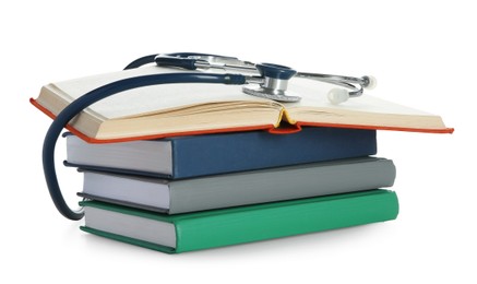 Photo of Stethoscope on stack of books against white background