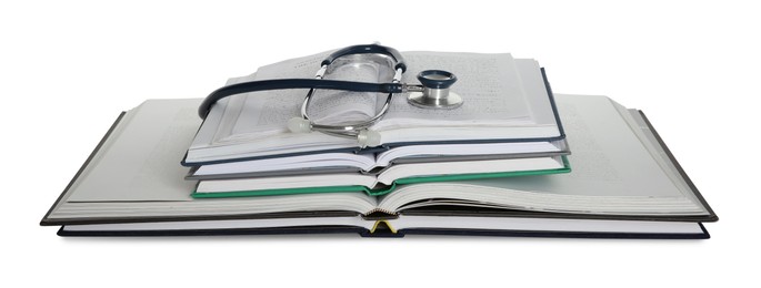 Stethoscope and stack of open books isolated on white