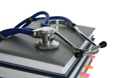 Photo of Stethoscope on stack of books against white background
