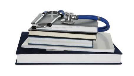 Stethoscope and stack of books isolated on white