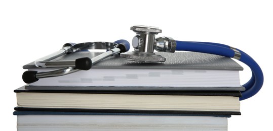 Photo of Stethoscope and stack of books isolated on white