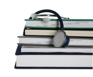 Photo of Stethoscope and stack of books isolated on white