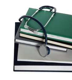 Photo of Stethoscope and stack of books isolated on white