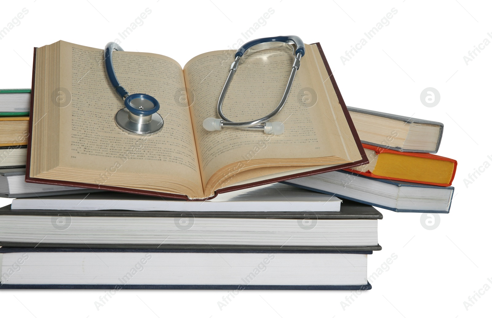 Photo of Stethoscope and stack of books isolated on white