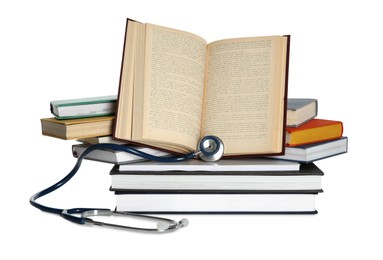 Stethoscope and stack of books isolated on white