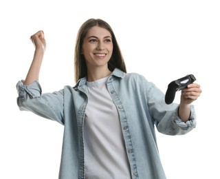 Happy woman playing video games with controller on white background