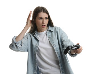 Surprised woman playing video games with controller on white background