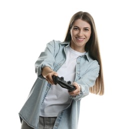 Happy woman playing video games with controller on white background