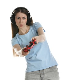 Photo of Woman in headphones playing video games with controller on white background