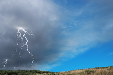 Image of Blue sky with coming thundercloud. Weather changes