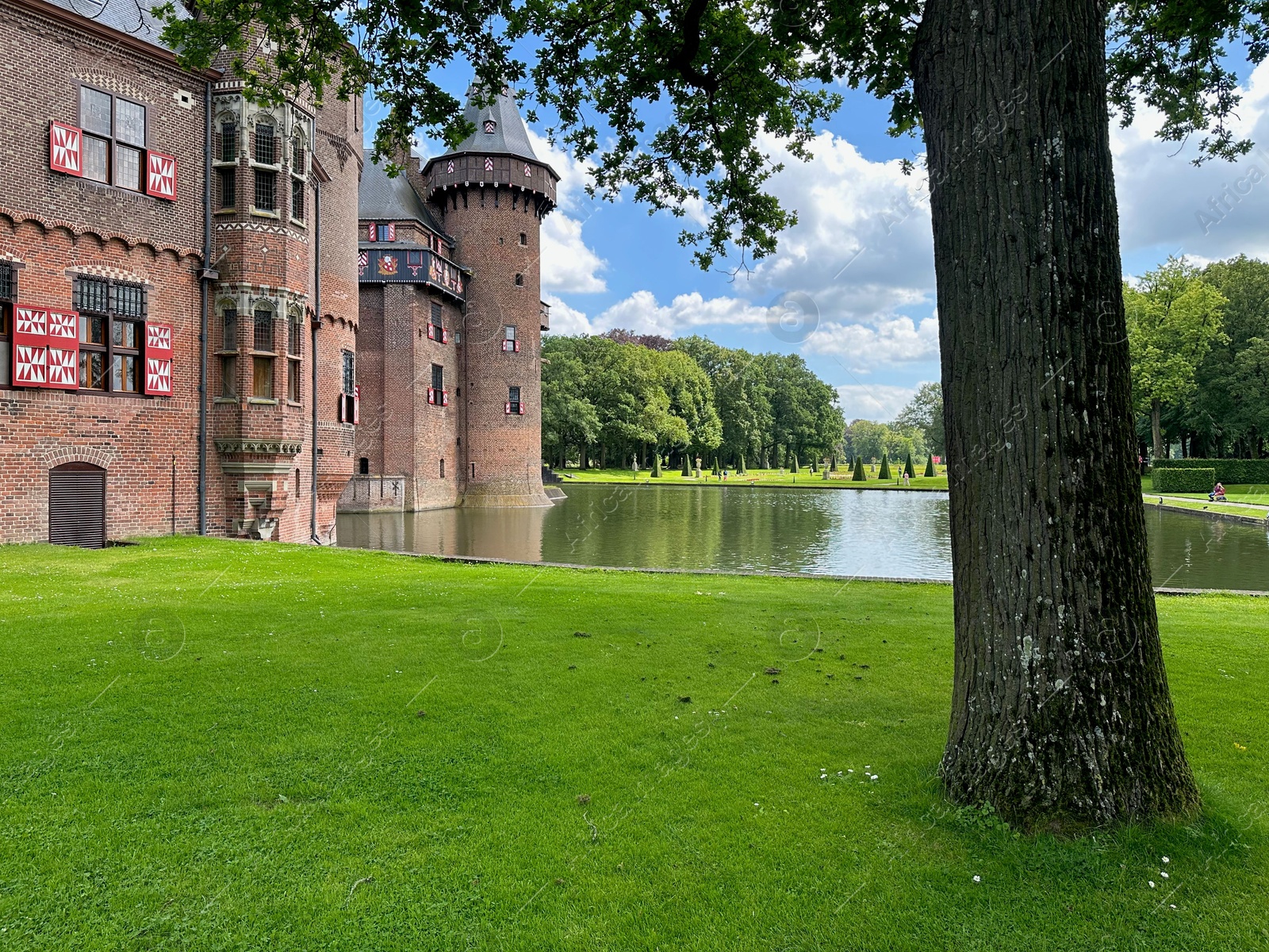 Photo of Utrecht, Netherlands - June 17, 2024: Beautiful De Haar castle, lake and tree outdoors