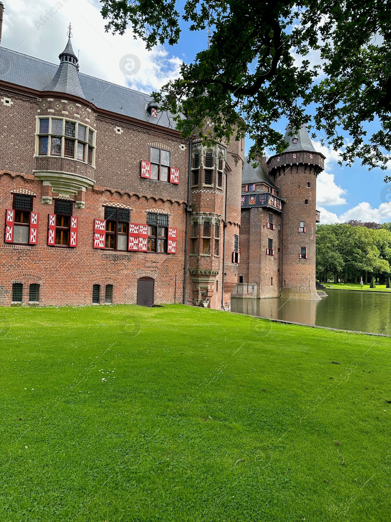 Photo of Utrecht, Netherlands - June 17, 2024: Beautiful De Haar castle and lake outdoors