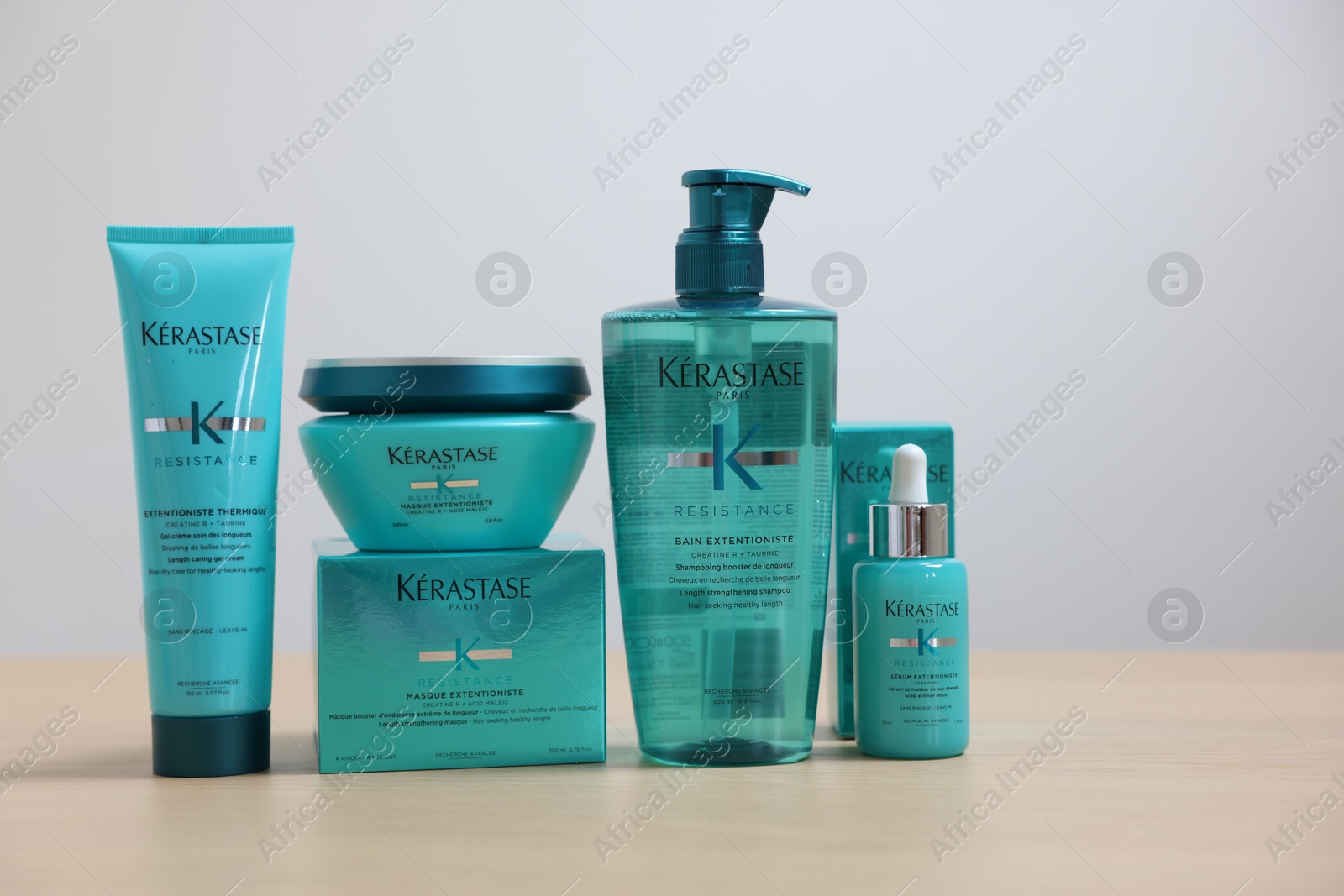 Photo of Leiden, Netherlands - June 11, 2024: Kerastase hair care cosmetic products on wooden table against light background