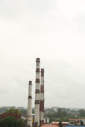Photo of Modern power station in city on cloudy day